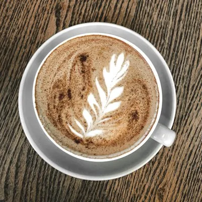 Flat white coffee on a café website menu